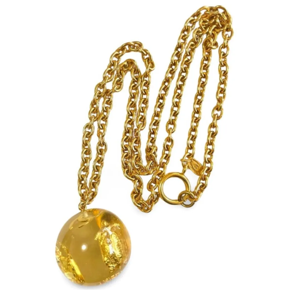 Vintage CHANEL long chain necklace with resin ball top, CC mark, turtle, camellia, clover, and 2.55 bag motifs in it. 060312ac4
