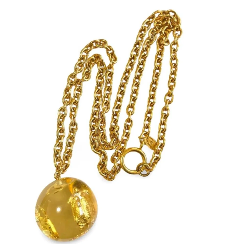 Vintage CHANEL long chain necklace with resin ball top, CC mark, turtle, camellia, clover, and 2.55 bag motifs in it. 060312ac4